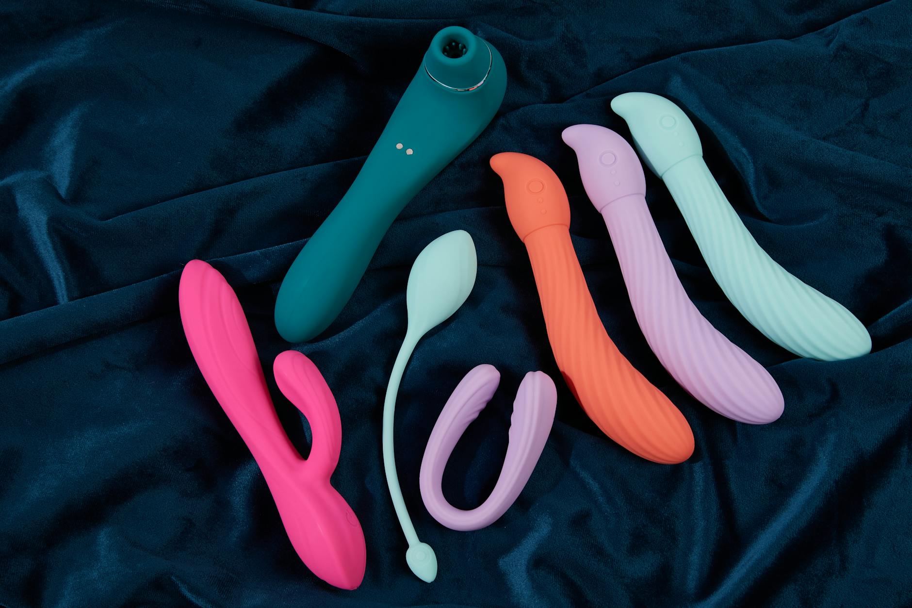 A couple reconnecting with intimacy, holding a blue vibrator together, symbolizing modern partnership and trust