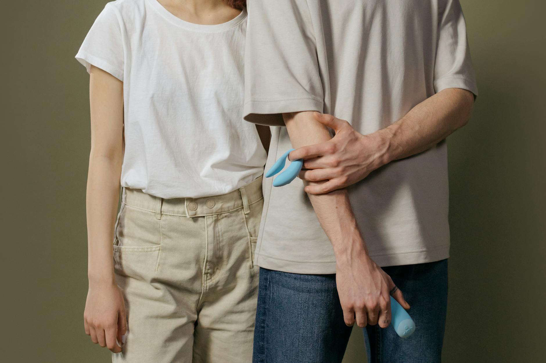 A young couple standing close together indoors, symbolizing reconnection and modern intimacy exploration.